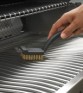 grill brush_in_use-napoleon-grills copy